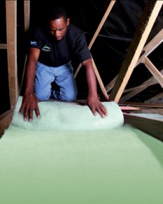 Man installing ceiling insulation